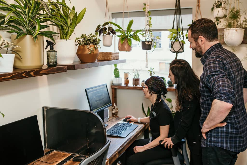 Dental staff analyzing scans